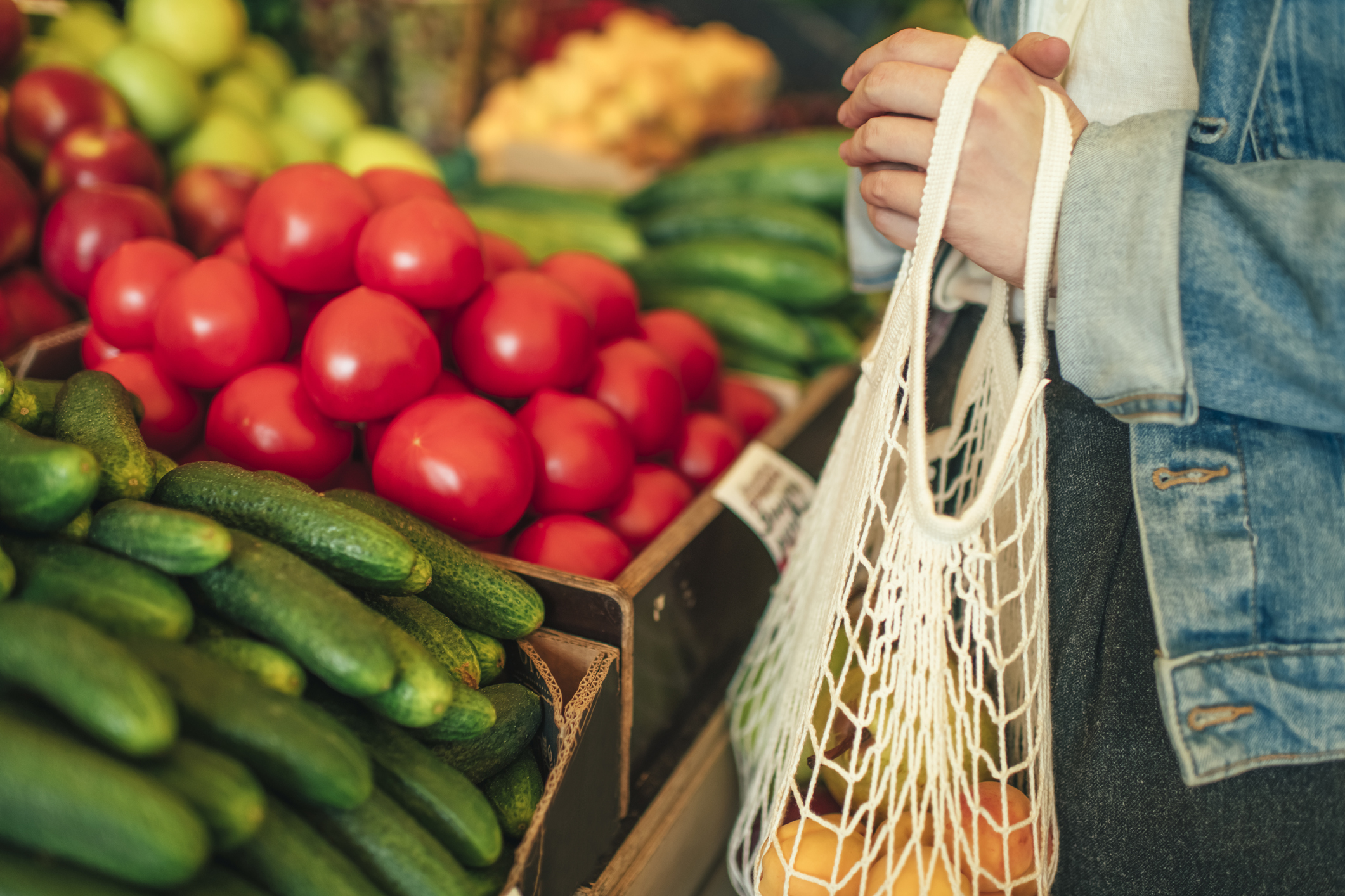 Close-up of ecologically friendly reusable bag with fruit and vegetables