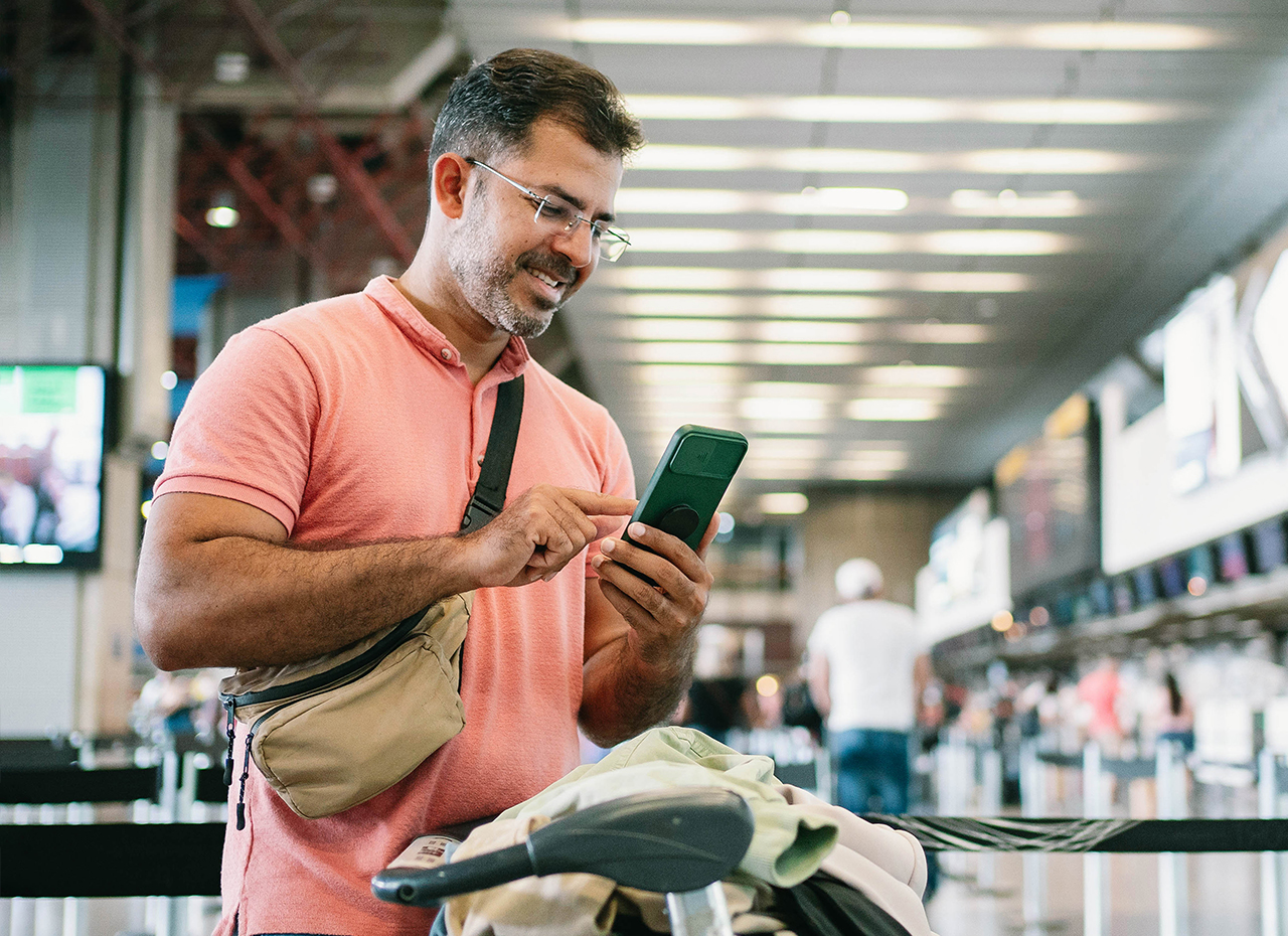 Mature man at airport managing diabetes