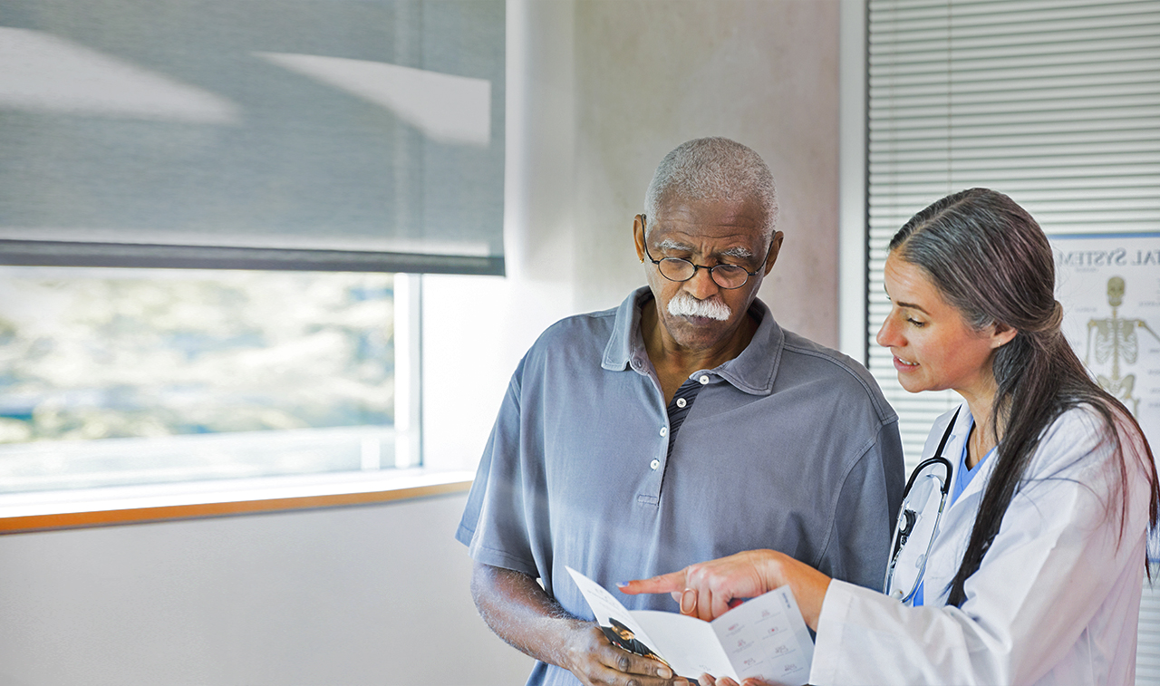 Doctor conferring with patient