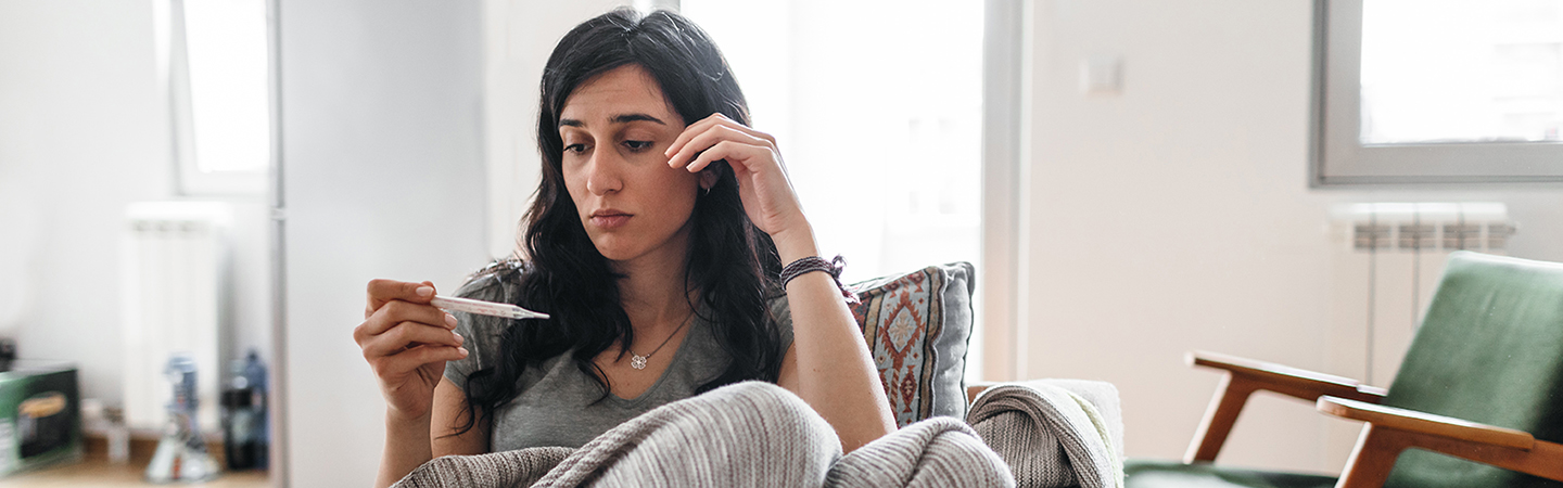 Young woman sick at home.