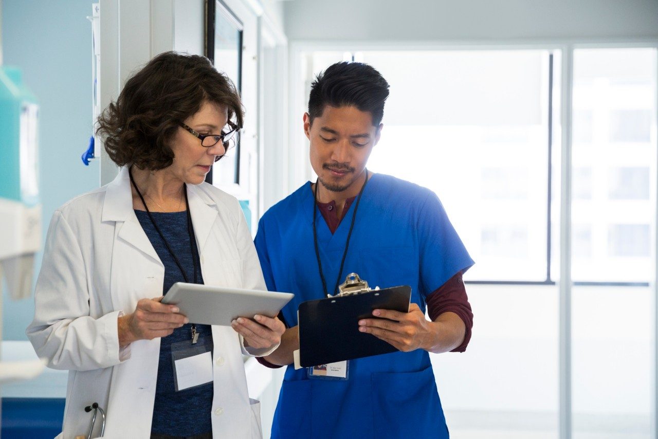 Doctor and nurse conferring 