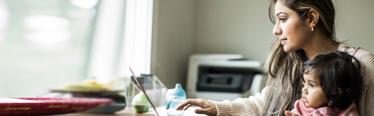 Woman and child looking at laptop