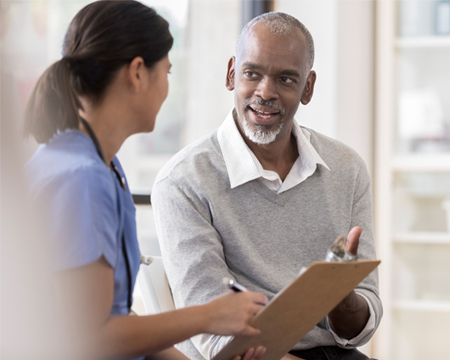 patient and medical professional with checklist