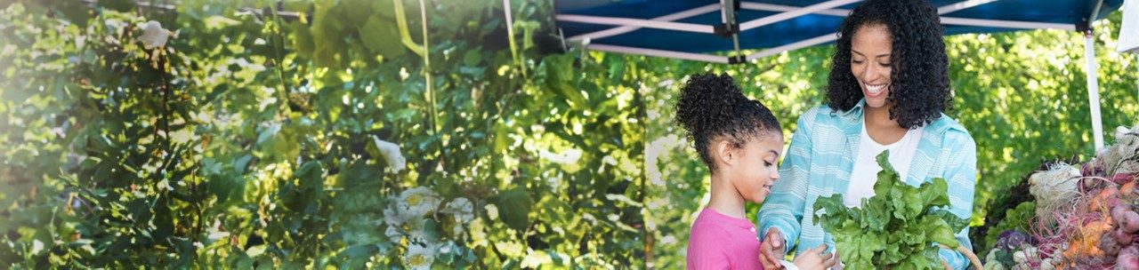 African American woman with child at a farmer's market