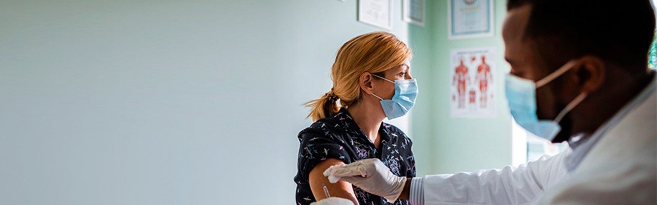 woman getting vaccine