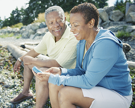 senior happy couple managing diabetes on vacation