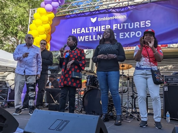 Member of Congress Yvette D. Clarke addresses the crowd with EmblemHealth Vice President Hulse, Dr. Bob Lee, Assembly Member Walker and Council Member Mealy on hand.